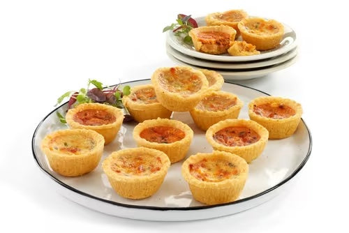 Vegetarian tartlets platter with cheese, onion, mushroom, and sundried tomato filling, served as a platter of 15 pieces